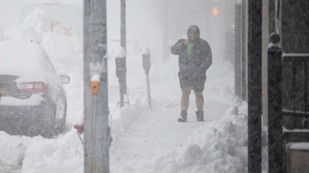PHOTO: A person walks through downtown in the snow Friday, Nov. 18, 2022, in Buffalo, N.Y. A dangerous lake-effect snowstorm paralyzed parts of western and northern New York, with nearly 2 feet of snow already on the ground in some places.