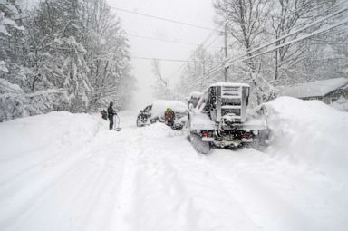 PHOTO: Good Samaritans help dig out a plow after an intense lake-effect snowstorm impacted the area on Nov. 18, 2022, in Hamburg, N.Y.