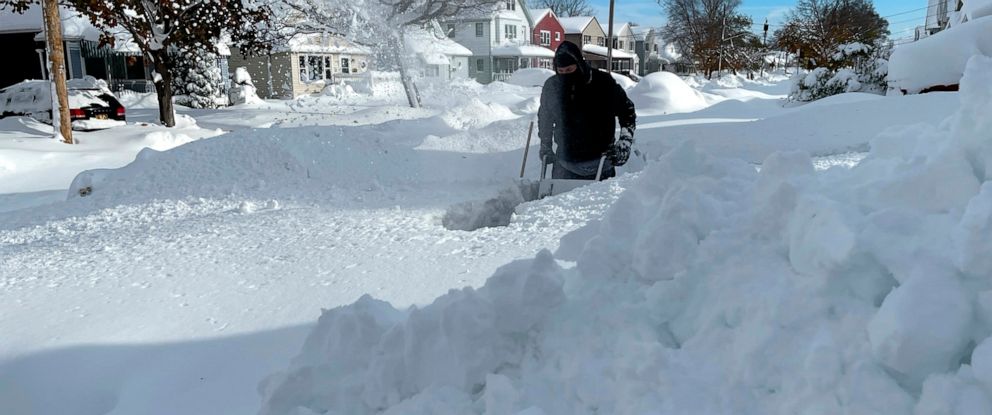 PHOTO: Martin Haslinger uses a snowblower outside his home in Buffalo, N.Y., on Nov. 19, 2022 following a lake-effect snowstorm.