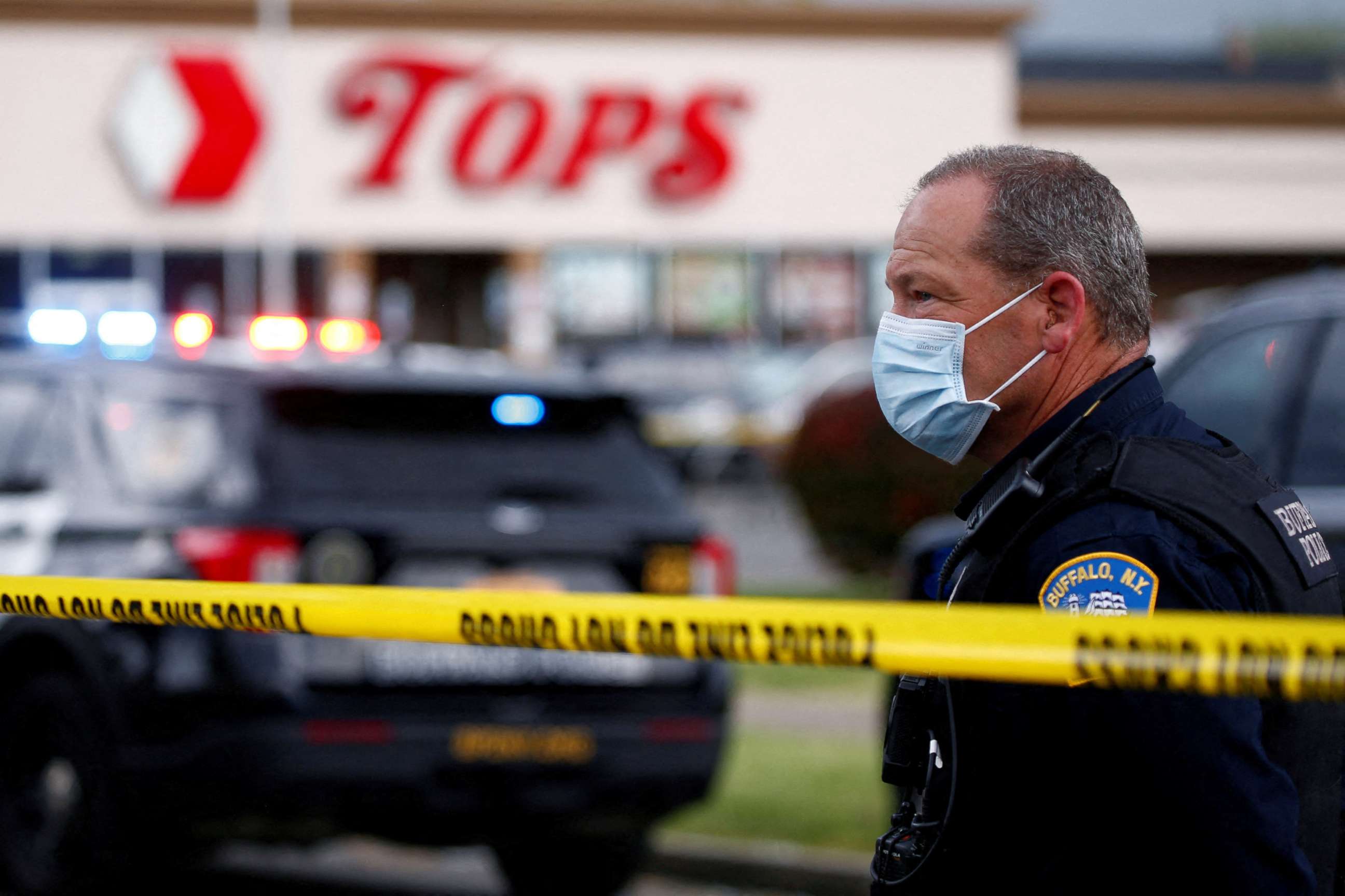 PHOTO: Police officers secure the scene after a shooting at TOPS supermarket in Buffalo, N.Y., May 14, 2022. 