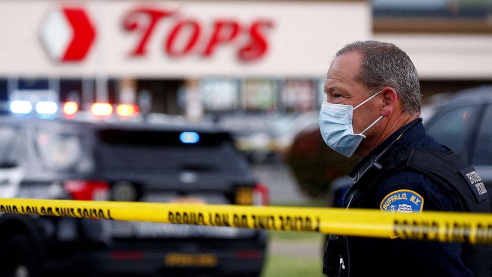 PHOTO: Police officers secure the scene after a shooting at TOPS supermarket in Buffalo, N.Y., May 14, 2022. 