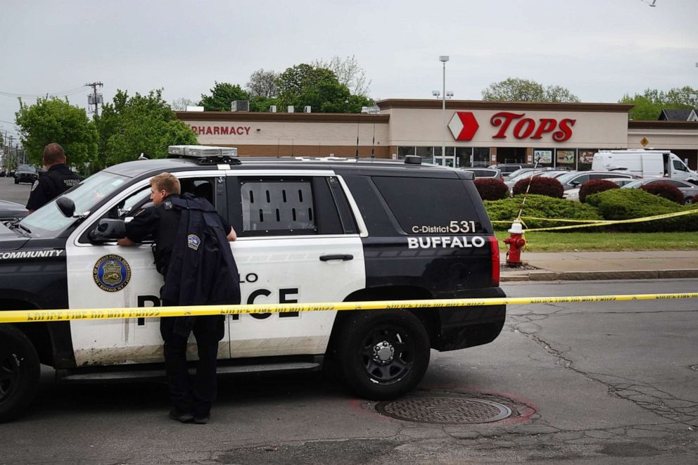 PHOTO: Police and FBI agents continue their investigation of the shooting at Tops Market on May 16, 2022 in Buffalo, New York.
