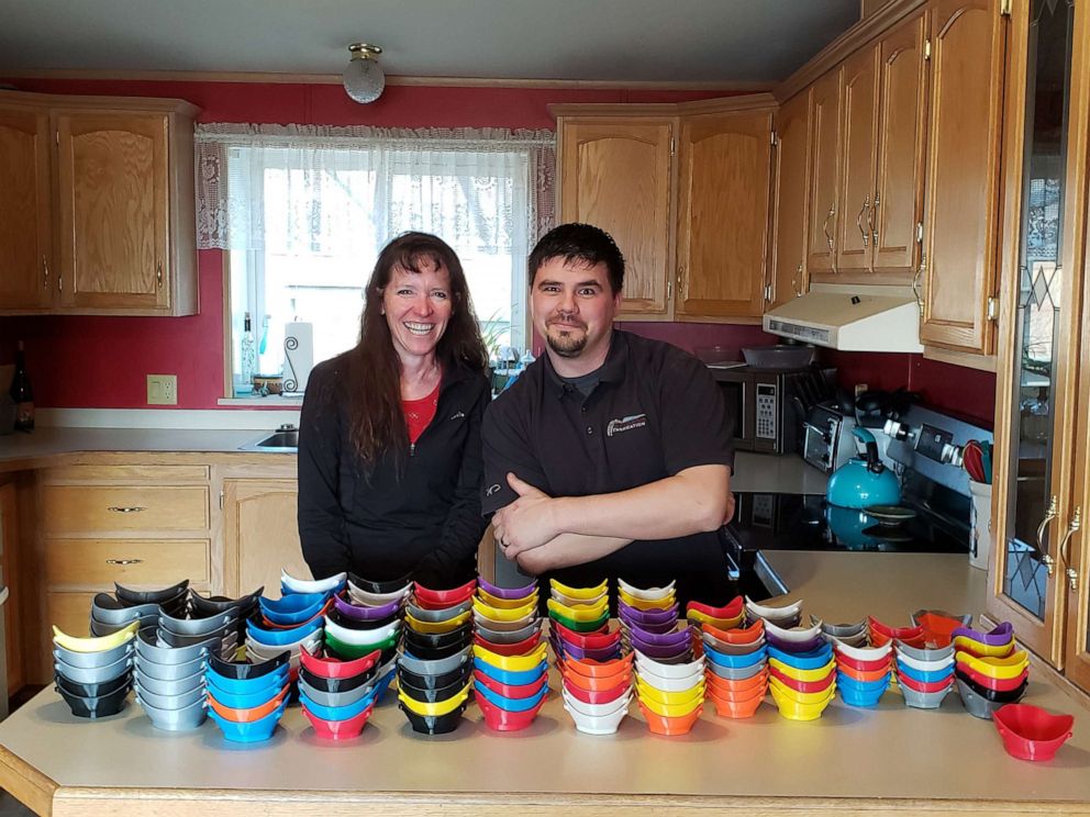 PHOTO: Montana public school teachers Buffy Smith, left, and Jake Spearson, right, are using 3D printers to manufacture plastic face masks for donation to medical and public safety workers facing COVID-19.