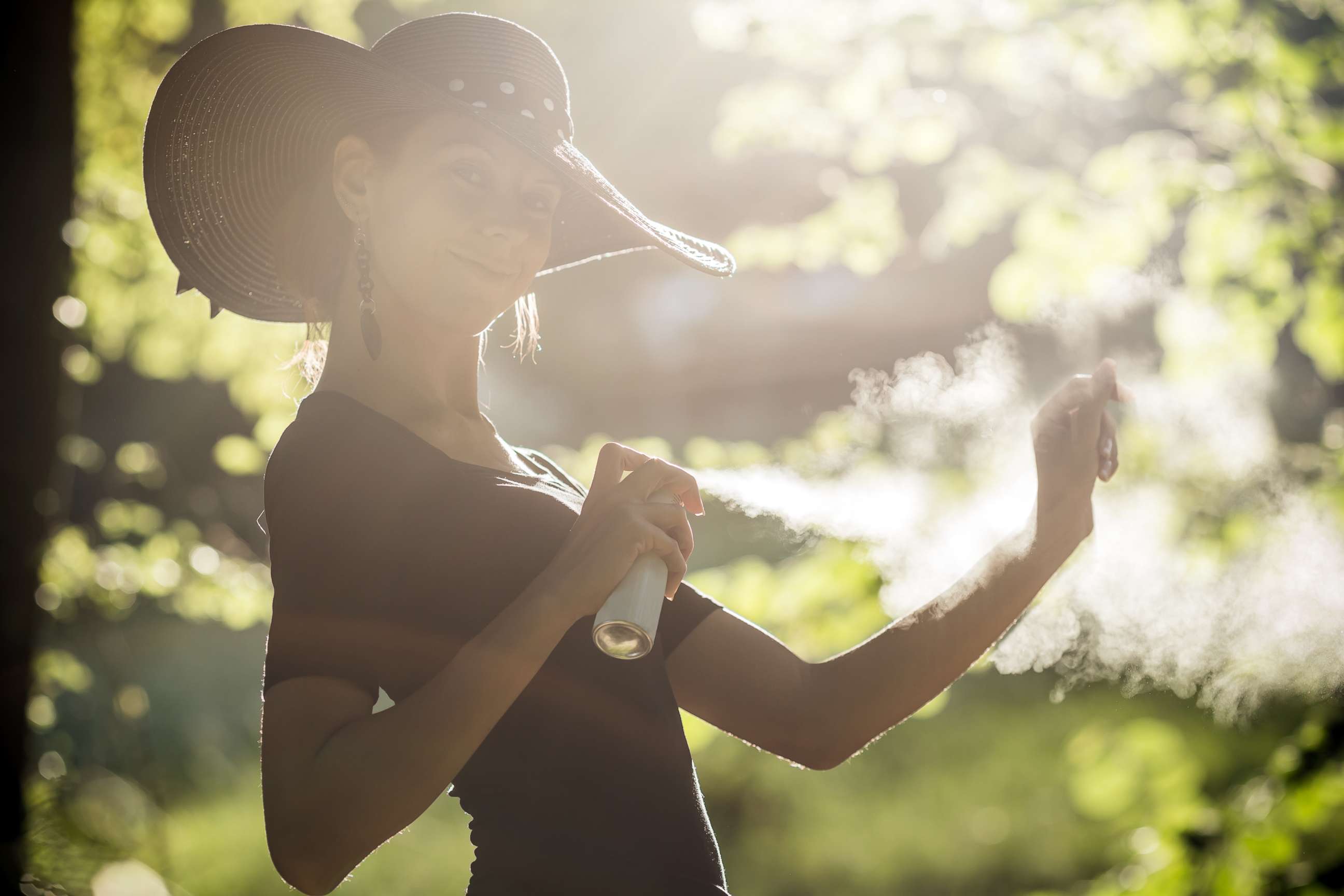 PHOTO: A woman sprays insect repellent on in this undated stock image.