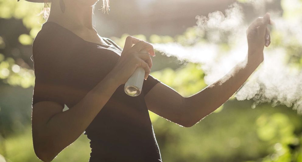 PHOTO: A woman sprays insect repellent on in this undated stock image.