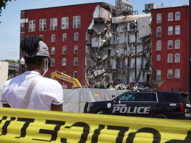 Officials delay demolition of partially collapsed building amid renewed search