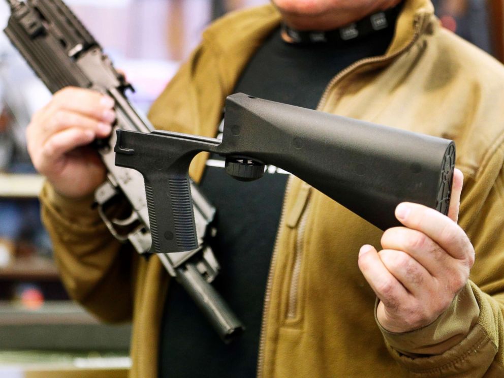 PHOTO: A bump stock device (right), that fits on a semi-automatic rifle to increase the firing speed, making it similar to a fully automatic rifle, is shown next to a AK-47 semi-automatic rifle at a gun store on Oct. 5, 2017, in Salt Lake City, Utah.   