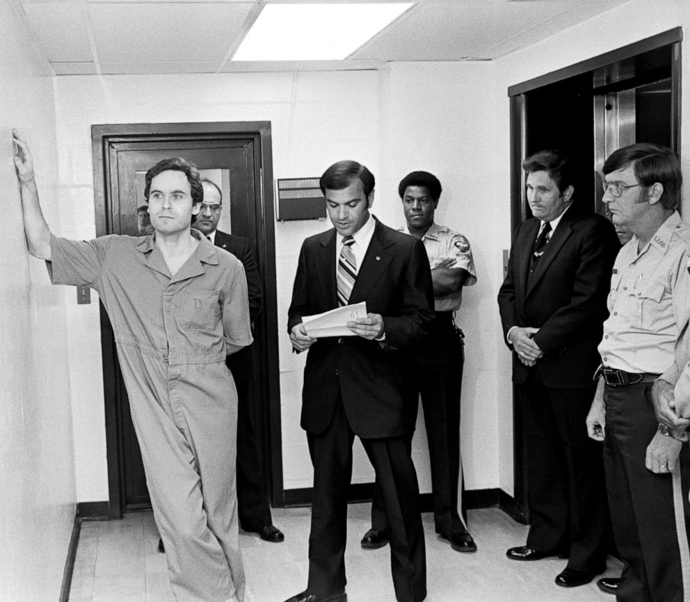 PHOTO: Suspected murderer Ted Bundy leans on the Leon County jail wall as an indictment charging him with the murders of two FSU coeds at the Chi Omega house is read by Leon County Sherriff Ken Katarsis in Tallahassee, Fla., July 27, 1978.