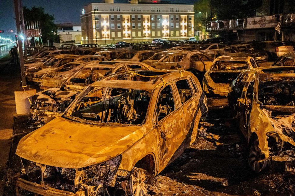 PHOTO: The carcasses of the cars burned by protestors the previous night, during a demonstration against the police shooting of Jacob Blake, are seen on a used-cars lot in Kenosha, Wisconsin, on Aug. 26, 2020.