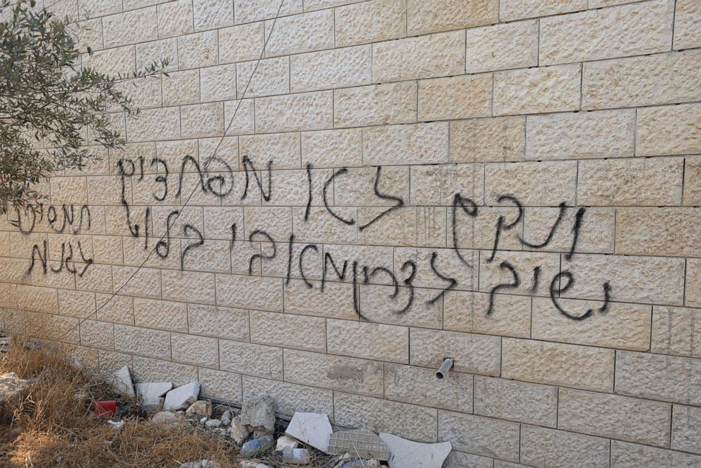 PHOTO: A view of graffiti left by Israeli settlers on Al-Hajja Hamida Mosque, after an attack by Israeli settlers, in Der Estya village, near Salfitt, the West Bank, November 13, 2025.