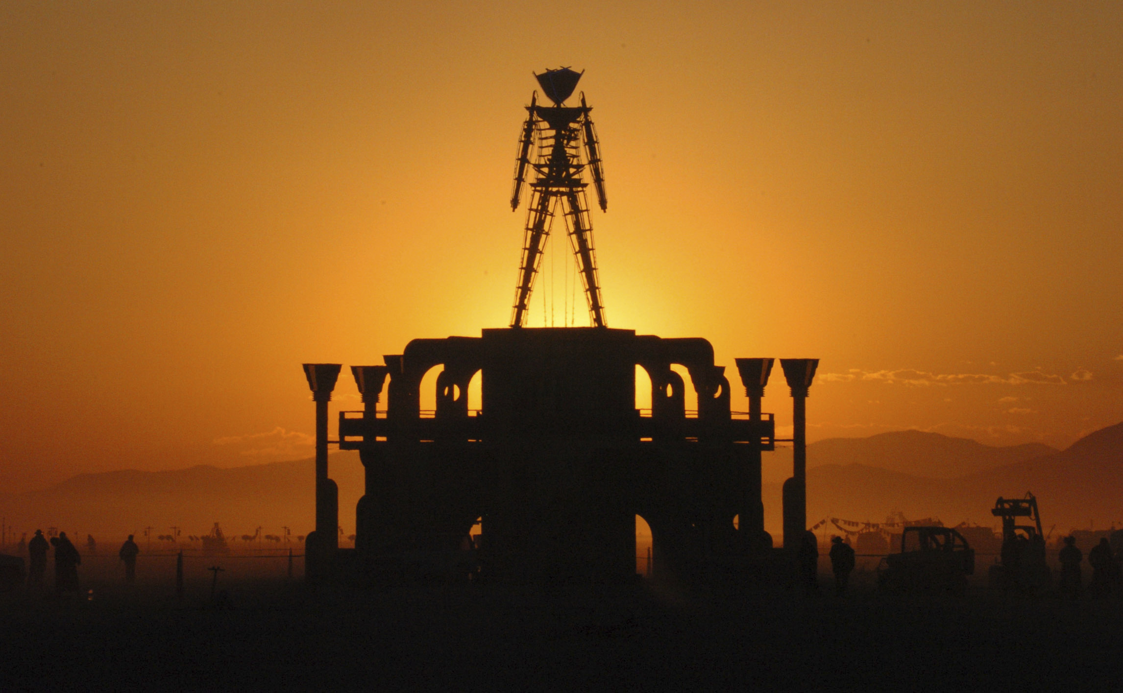 PHOTO: In this Sept. 2, 2006 file photo, The Man, a stick figured symbol of the Burning Man art festival, is silhouetted against a morning sunrise in Nevada's Black Rock Desert.
