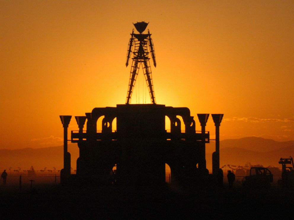 PHOTO: In this Sept. 2, 2006 file photo, The Man, a stick figured symbol of the Burning Man art festival, is silhouetted against a morning sunrise in Nevadas Black Rock Desert.