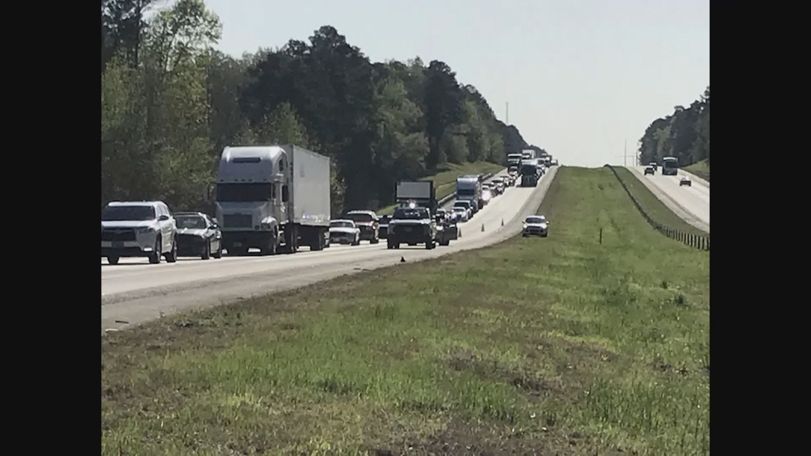 PHOTO:A  view of traffic caused by a charter bus that crashed on the eastbound interstate 20, April 5, 2018 near Harlem, Ga.