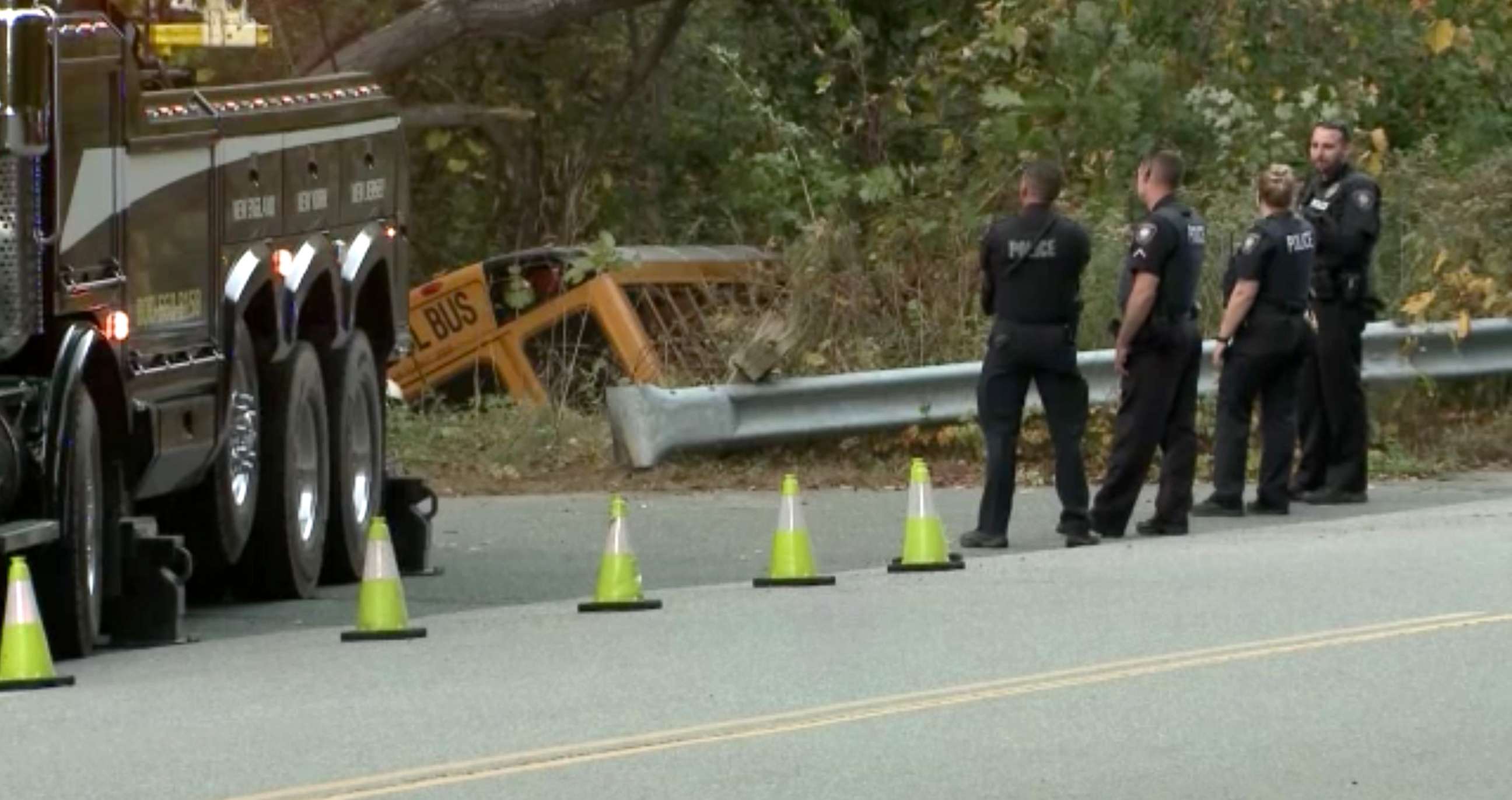 PHOTO: Two moms rescue children after their school bus crashed into the woods in Plaistow, N.H., Oct. 12, 2021.