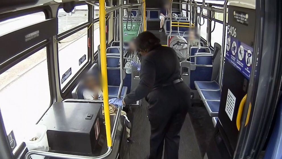 PHOTO: Milwaukee County Transit System driver Cecilia Nation-Gardner gets to know a six-year-old boy she rescued from a busy intersection while waiting for police.