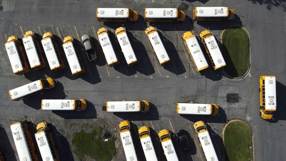 PHOTO: In this July 10, 2020 file photo school buses are seen parked at the Montgomery County Public Schools bus depot, in Derwood, Md.