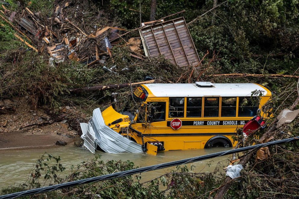 PHOTO: A Perry County school bus, along with other debris, sits in a creek near Jackson, Kentucky, on July 31, 2022.
