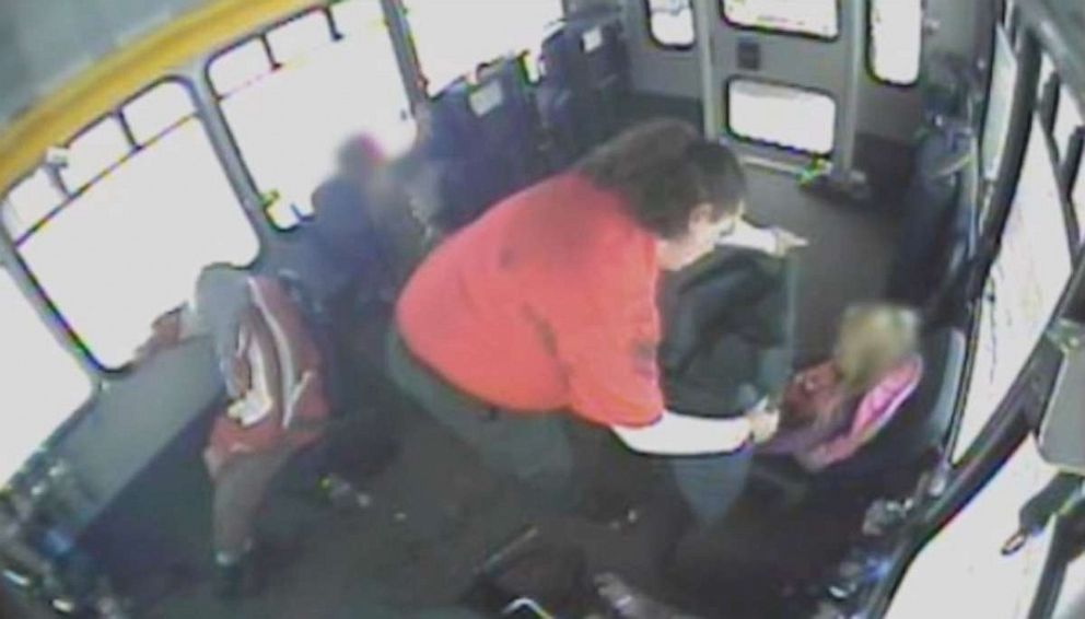 PHOTO: A camera on the bus caught Chamberlain shedding her coat to help cover the toddler’s bare legs.