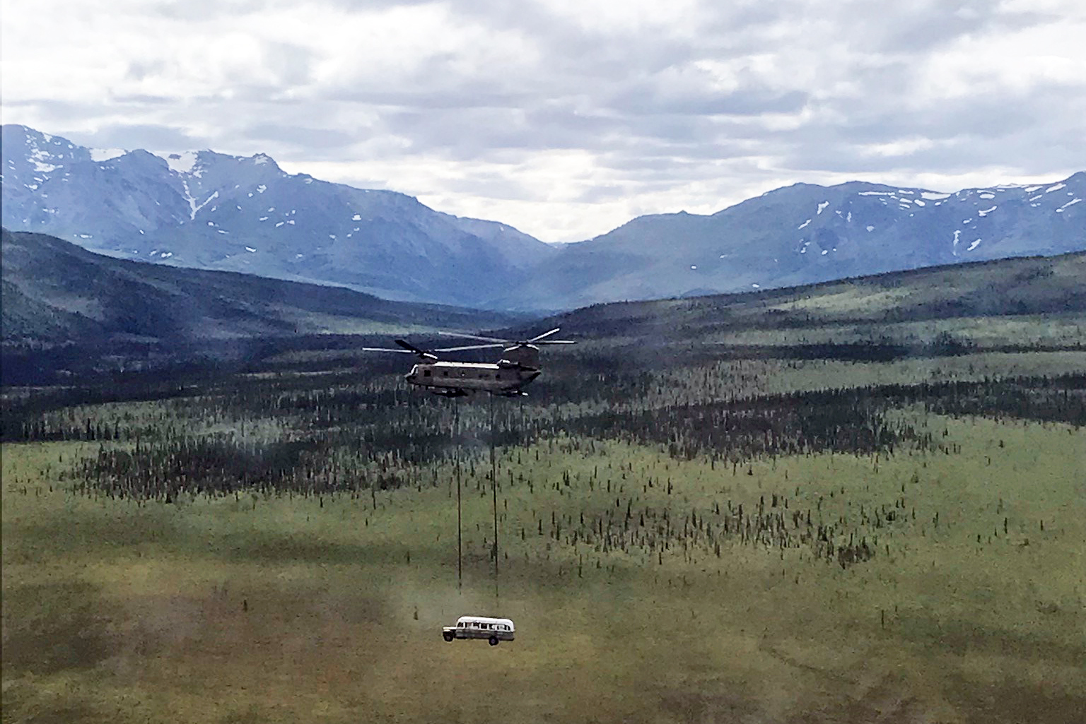 PHOTO: A National Guard Chinook helicopter lifts Fairbanks Bus 142, made famous by the book and film "Into the Wild," from the remote Stampede Trail outside Denali National Park, near Healy, Alaska, on June 18, 2020.
