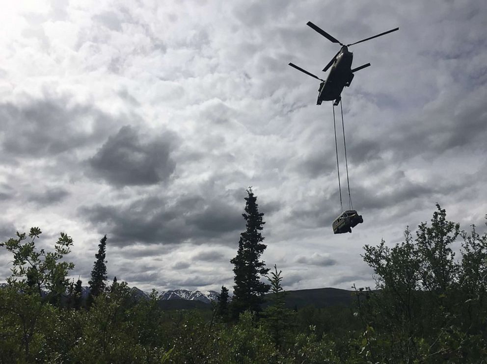 PHOTO: A National Guard Chinook helicopter lifts Fairbanks Bus 142, made famous by the book and film "Into the Wild," from the remote Stampede Trail outside Denali National Park, near Healy, Alaska, on June 18, 2020.