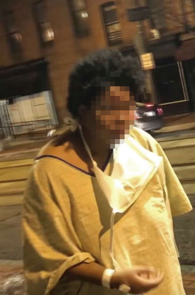 PHOTO: An image taken from video provided by Imamu Baraka shows a woman discharged from a Baltimore hospital at a bus stop wearing only a gown and socks on a cold winter's night, Jan. 9, 2018.