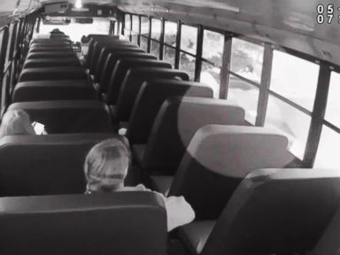 Distracted deputy comes disturbingly close to slamming into student boarding bus
