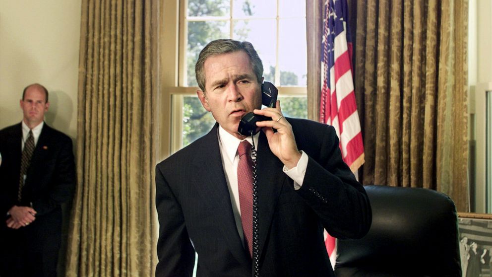 PHOTO: President George W. Bush speaks by telephone from the Oval Office at the White House in Washington, D.C., with New York City Mayor Rudolph Giuliani and New York Governor George Pataki, Sept. 13, 2001. 