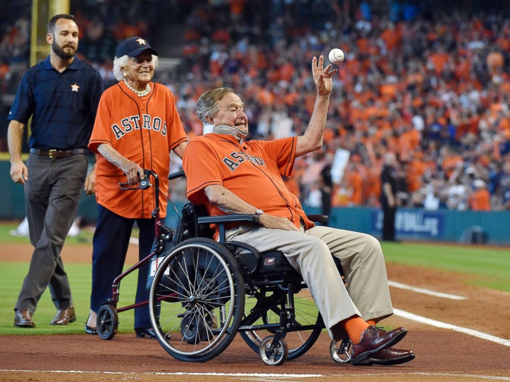 PHOTO: Former first lady Barbara Bush and former President George H.W. Bush throws the ceremonial first pitch before an ALDS baseball game between the Houston Astros and the Kansas City Royals, Oct. 11, 2015, at Minute Maid Park in Houston.