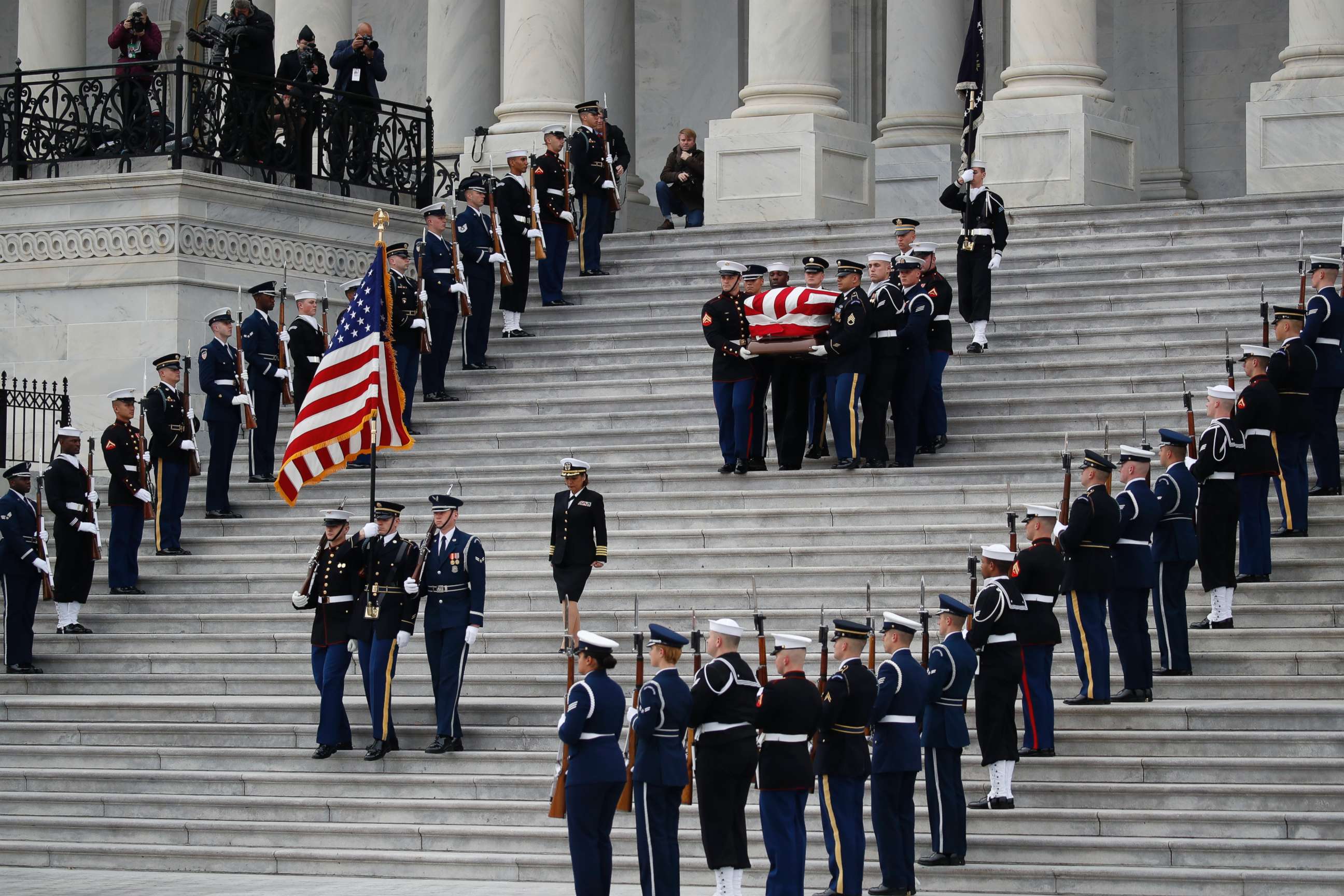 PHOTO: The flag-draped casket of former President George H.W. Bush is carried by a joint services military honor guard from the U.S. Capitol, Dec. 5, 2018, in Washington.