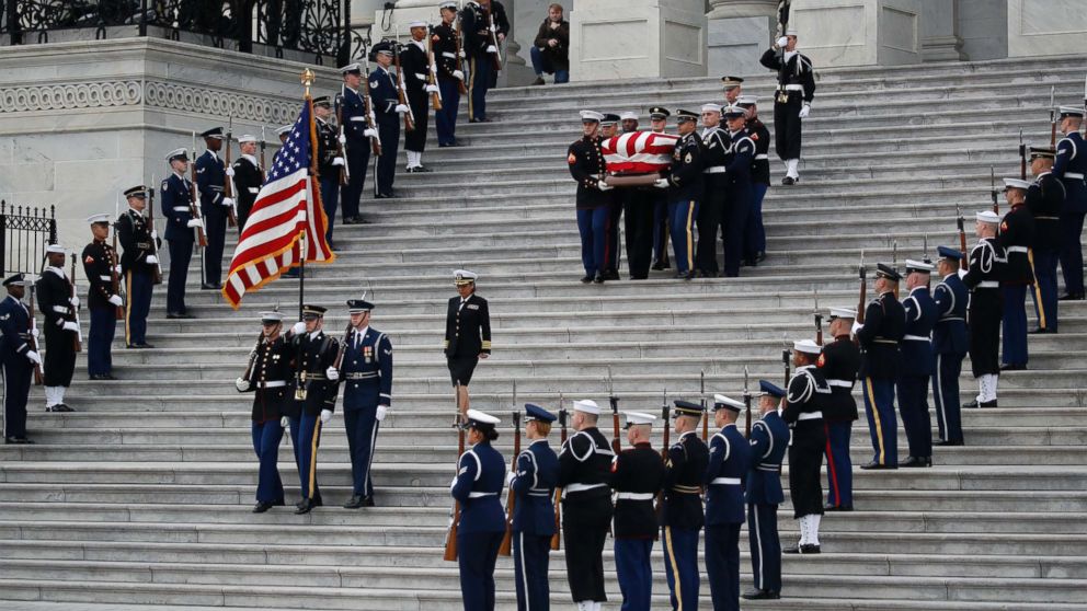 PHOTO: The flag-draped casket of former President George H.W. Bush is carried by a joint services military honor guard from the U.S. Capitol, Dec. 5, 2018, in Washington.