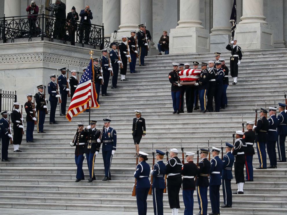 PHOTO: The flag-draped casket of former President George H.W. Bush is carried by a joint services military honor guard from the U.S. Capitol, Dec. 5, 2018, in Washington.