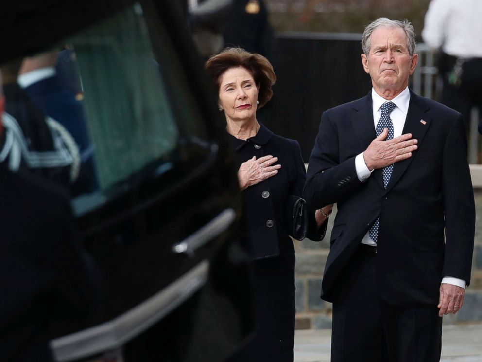 PHOTO: Former President George W. Bush and former first lady Laura Bush watch as the flag-draped casket of former President George H.W. Bush is carried to a State Funeral at the National Cathedral, Dec. 5, 2018 in Washington.