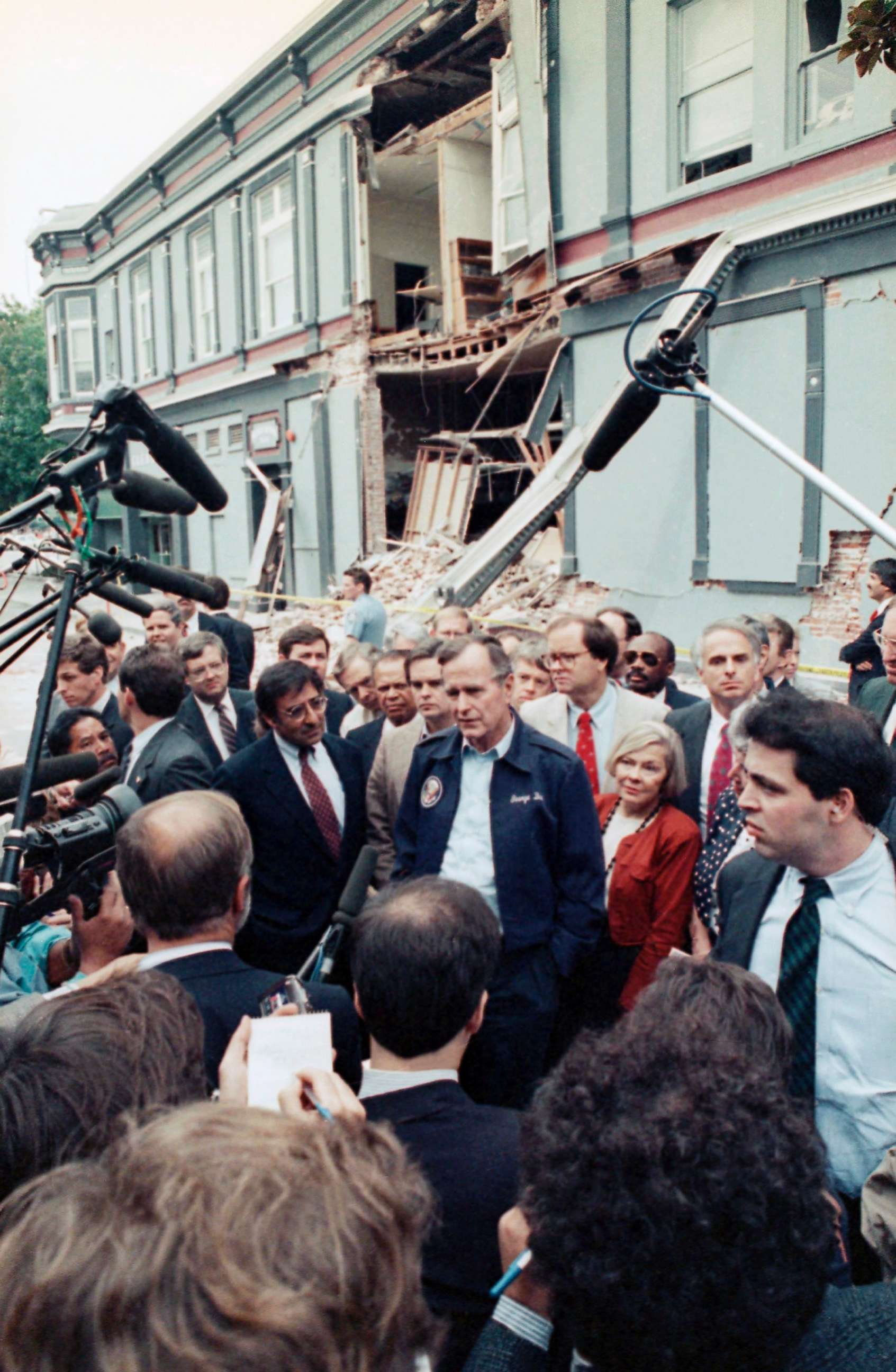 PHOTO: President George H. Bush, center, and Santa Cruz Mayor Mardi Wormhoudt, on Bush's left, talk to reporters in the Pacific Garden Mall area of Santa Cruz, Calif. Friday, Oct. 21, 1989, during a visit to the area following the earthquake.