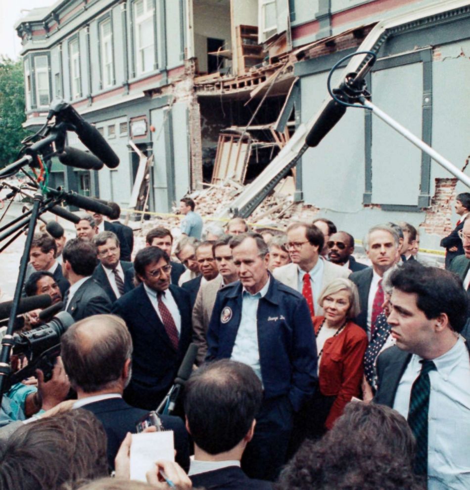 PHOTO: President George H. Bush, center, and Santa Cruz Mayor Mardi Wormhoudt, on Bush's left, talk to reporters in the Pacific Garden Mall area of Santa Cruz, Calif. Friday, Oct. 21, 1989, during a visit to the area following the earthquake.