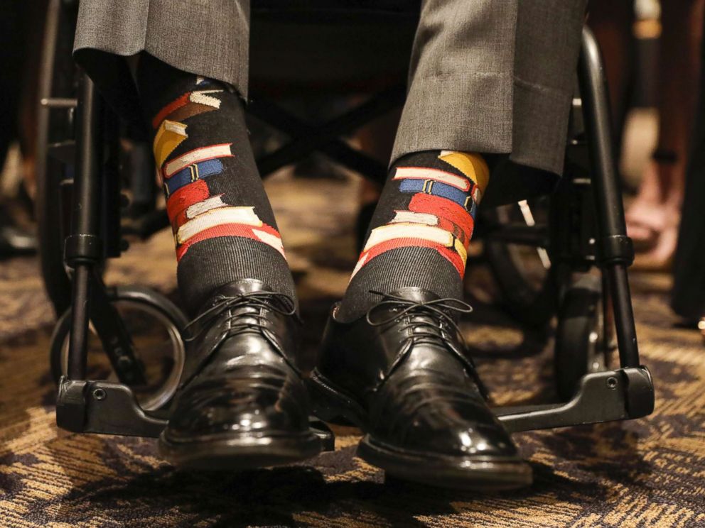 PHOTO: Former U.S. President George H.W. Bush wears socks printed with blue, red and yellow books during the funeral service for his wife, Barbara Bush, in Houston on April 21, 2018.