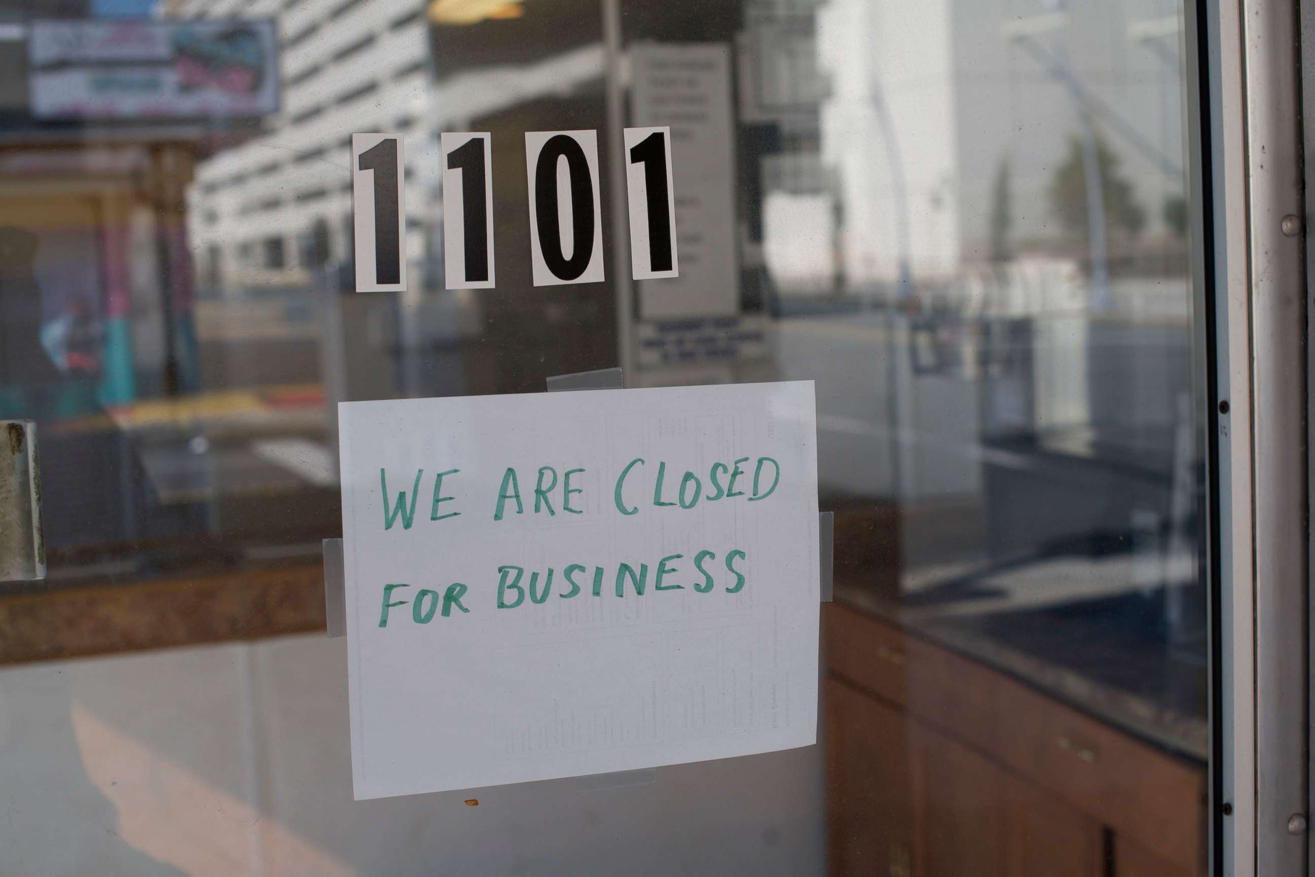 PHOTO: In this May 7, 2020, file photo, a sign at a motel lobby states "WE ARE CLOSED FOR BUSINESS" during the coronavirus pandemic in Atlantic City, N.J.