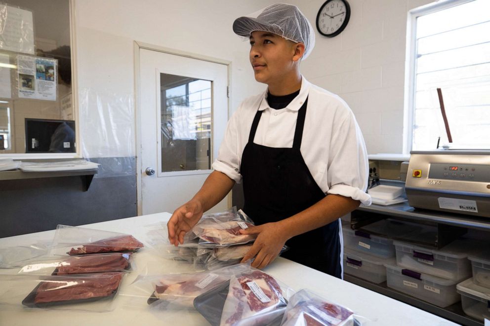PHOTO: A butcher at Old Fashion Country Butcher handles meat on May 21, 2020, in Santa Paula, Calif.