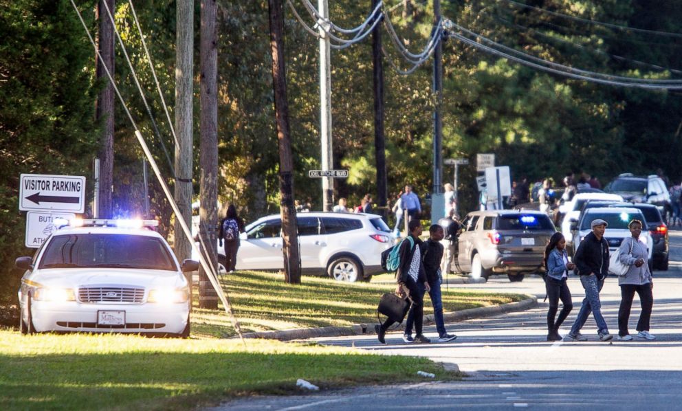 PHOTO: Parents walked to go pick up their kids outside Butler High School after the scene was considered safe in Matthews, N.C., Oct. 29, 2018.