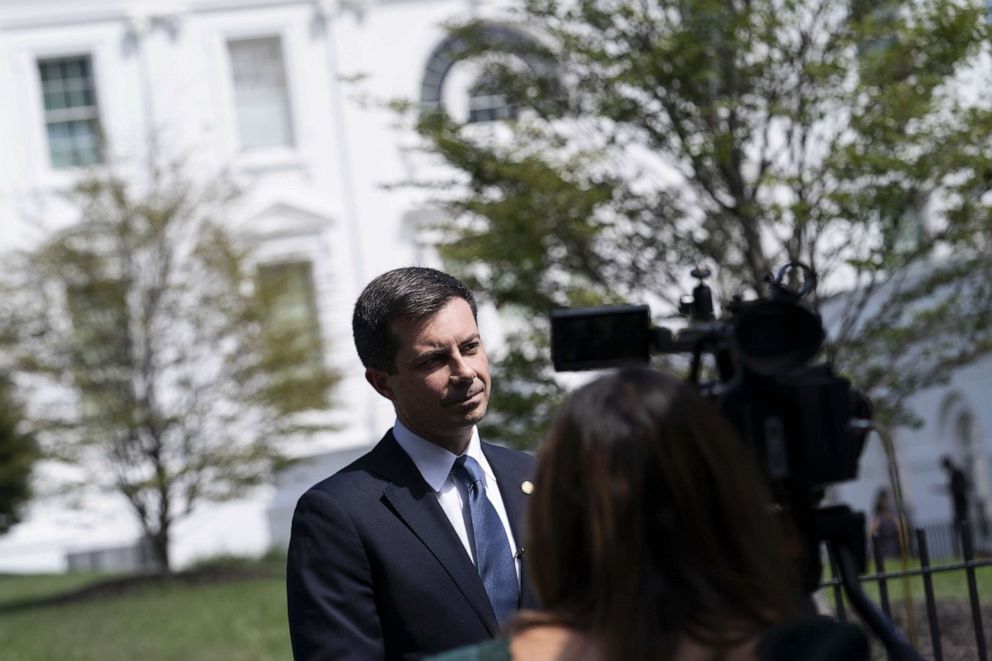 PHOTO: Pete Buttigieg, secretary of transportation, speaks to members of the media outside the West Wing before US President Joe Biden signs HR 5376, the Inflation Reduction Act of 2022, at the White House in Washington, DC, Aug.  16, 2022. 