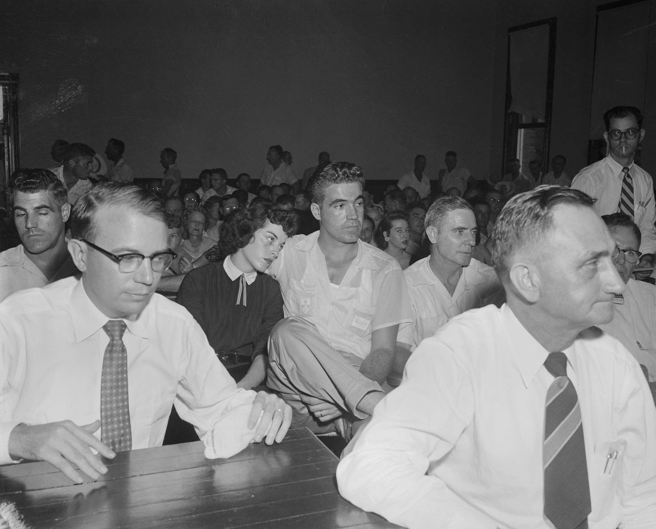 PHOTO: (Mrs. Carolyn Bryant sits with her husband Roy, in court where Roy and his half brother, J.W. Milam, are on trial for the "wolf whistle" kidnap murder of Emmett Louis Till, in Sumner, Mississippi, Sept. 22, 1955.