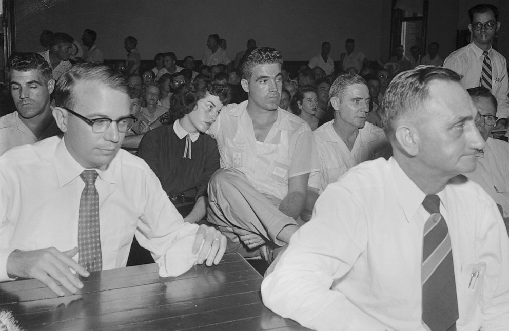 PHOTO: (Mrs. Carolyn Bryant sits with her husband Roy, in court where Roy and his half brother, J.W. Milam, are on trial for the 