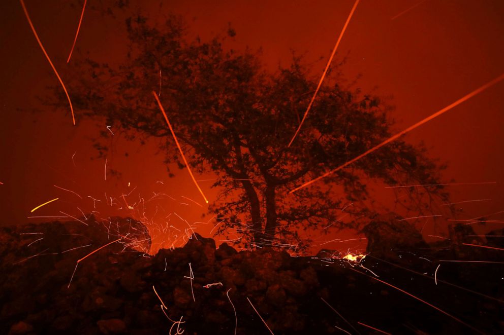 PHOTO: Embers blow in the wind as the Kincaide Fire burns through the area on October 24, 2019 in Geyserville, California.