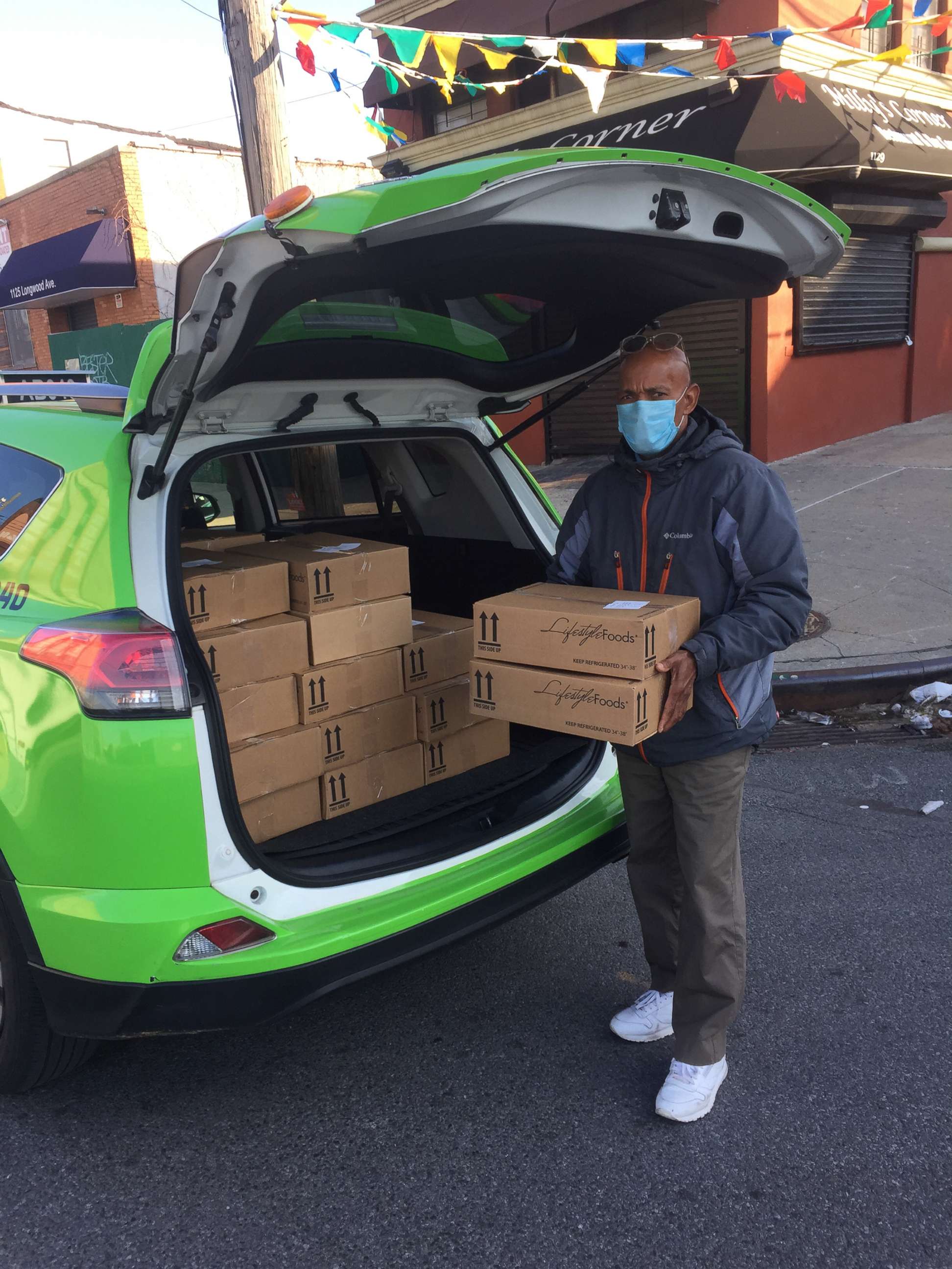 PHOTO: A green taxi driver delivers emergency food to vulnerable Bronx residents, such as the elderly and immunocompromised.