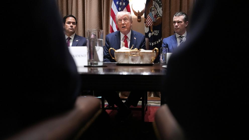 PHOTO: President Donald Trump sits between Secretary of State Marco Rubio and Secretary of Defense Pete Hegseth as he delivers remarks during a Cabinet Meeting at the White House, Feb. 26, 2025, in Washington.