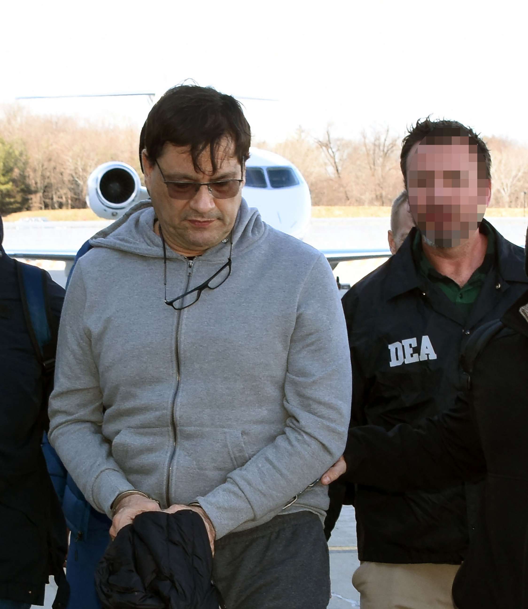 PHOTO: Federal agents escort David Cardona-Cardona as he arrives in the U.S. to face drug charges.