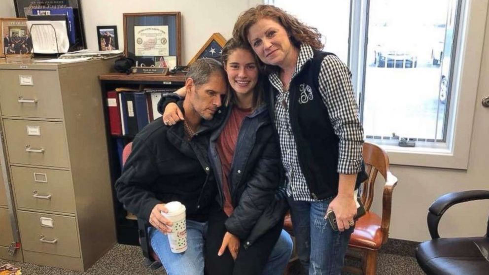 Caitlyn Frisina is pictured reunited with her parents in Syracuse, N.Y., Dec. 2, 2017.