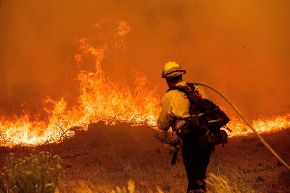 PHOTO: A firefighter battles the Caldor Fire along Highway 89, Tuesday, Aug. 31, 2021, near South Lake Tahoe, Calif.