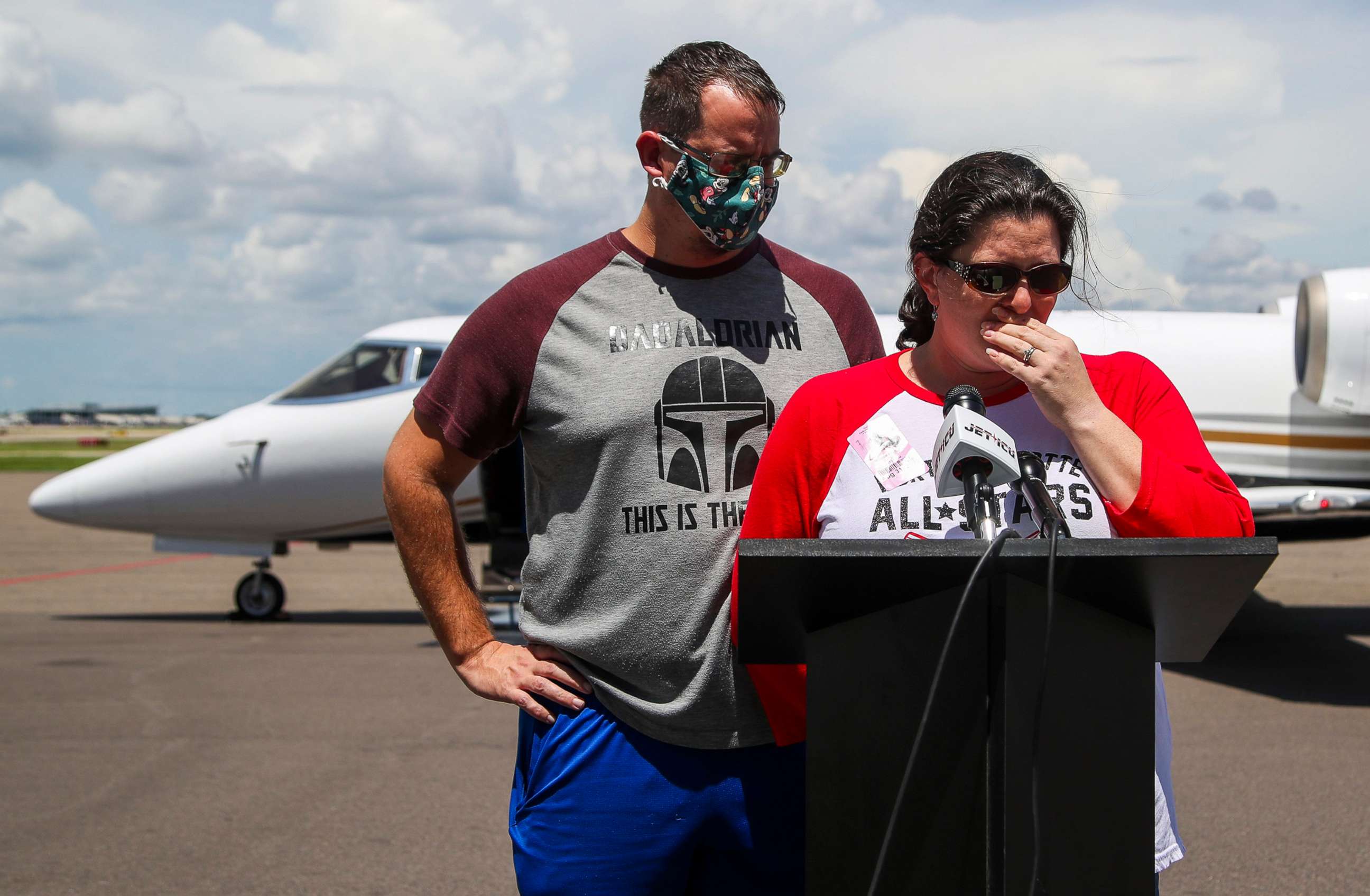 PHOTO: Eric and Jesse Ziegelbauer talk to reporters after their son Caleb was moved from an ambulance to an airplane, at Tampa International Airport, Aug. 31, 2022, in Tampa, Fla.