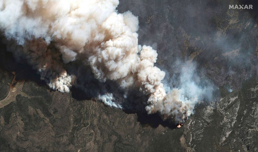 PHOTO:A satellite image shows a natural color view of active fire lines from the Hermits Peak and Calf Canyon fires, near Las Vegas, May 11, 2022.