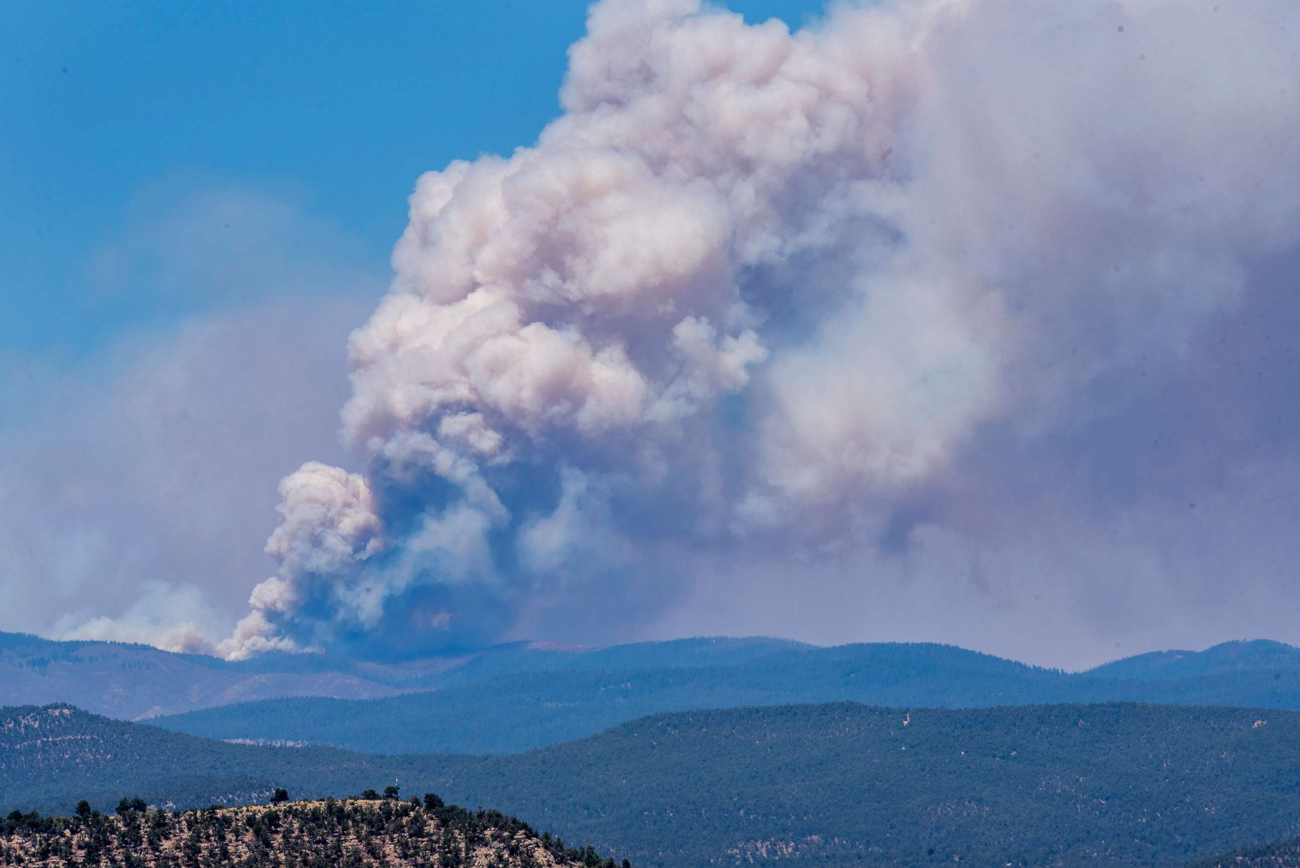 PHOTO: The Calf Canyon Hermits Peak Fire burns northeast of Pecos, N.M., on May 13, 2022.